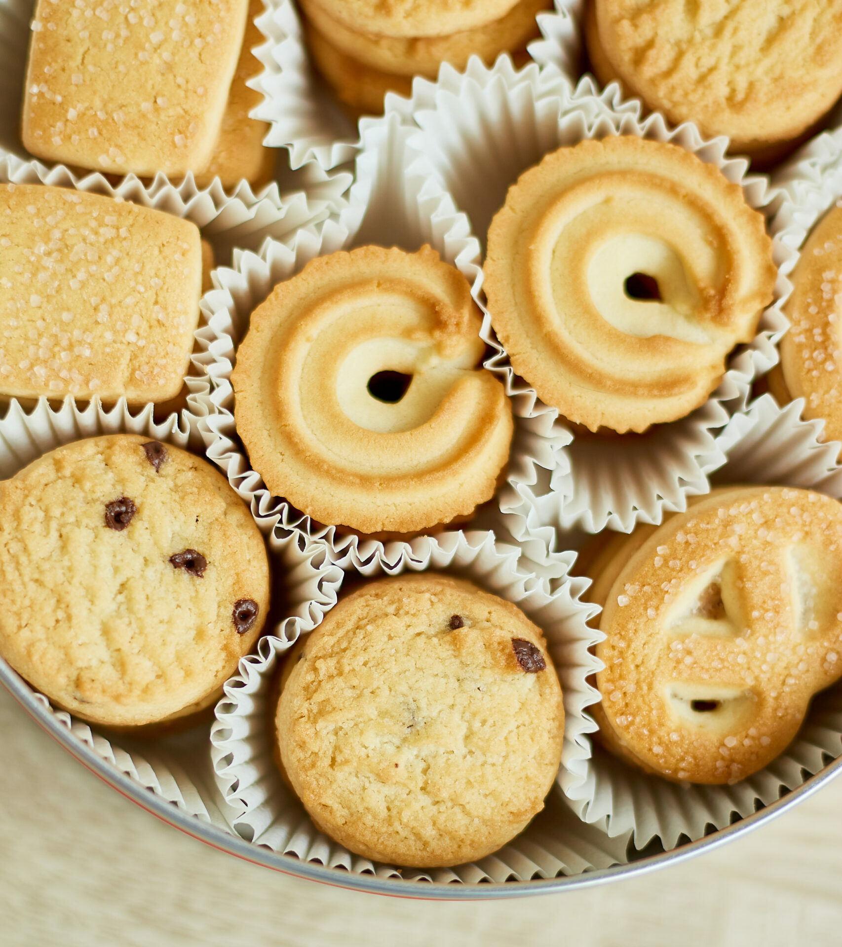 Top view tasty danish butter cookies in a tin box